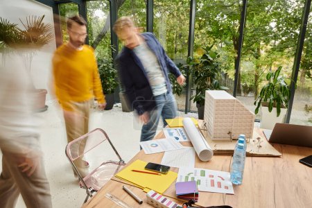 Photo for Long exposure of dedicated colleagues walking in office in blurred motion, startup concept - Royalty Free Image