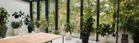 foto interior de la moderna sala de reuniones minimalista con mesas y plantas verdes en macetas, pancarta