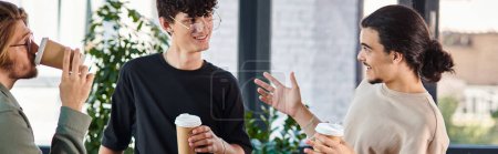 friendly conversation between three young coworkers holding coffee to go in modern office, banner