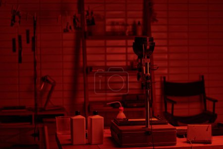 Photo for Darkroom interior with chemical bottles poised for use in the analog film development process - Royalty Free Image