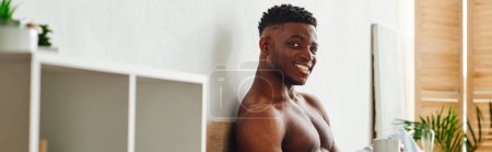 Photo for Athletic shirtless african american man with coffee cup smiling at camera in bedroom, banner - Royalty Free Image
