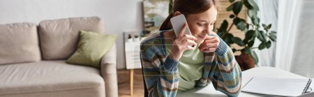Photo for Happy teenager girl making a phone call while studying online from home, horizontal banner - Royalty Free Image