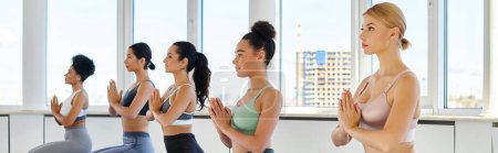 Photo for Banner of five young multicultural women with praying hands practicing yoga in bright studio - Royalty Free Image