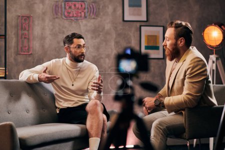 good looking bearded men in elegant stylish attires sitting and discussing interview questions