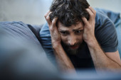 desperate man with beard screaming with hand on his face during breakdown, mental health awareness puzzle #694538074