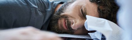suffering frustrated man with head on table during breakdown, mental health awareness, banner