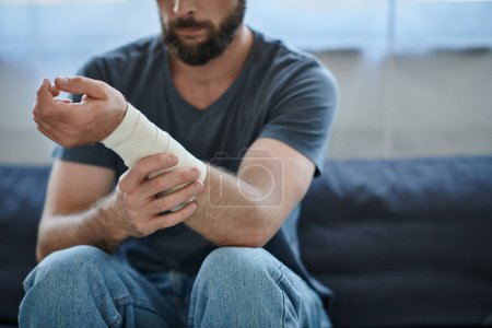 cropped view of depressed man with bandage on arm after attempting suicide, mental health awareness Stickers 694539278
