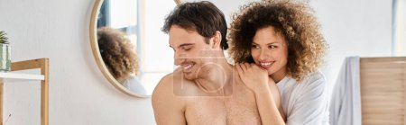 Photo for Portrait of happy young couple cuddling in the bathroom hugging in love and smiling, banner - Royalty Free Image