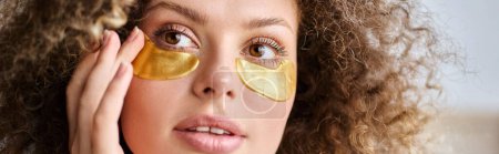 Closeup portrait of beautiful young  woman with eye patches  touching cheek and looking away, banner