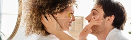 Photo for Portrait of couple with eye patches  hugging in bathroom and smiling, looking at each other, banner - Royalty Free Image