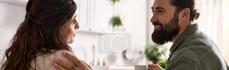 Photo for Positive man enjoying breakfast with his disabled merry wife in wheelchair at breakfast, banner - Royalty Free Image