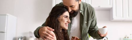 Photo for Joyous beautiful disabled woman in wheelchair enjoying breakfast with her bearded husband, banner - Royalty Free Image