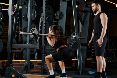 A personal trainer guides a brunette sportswoman as they both perform squats in a gym.
