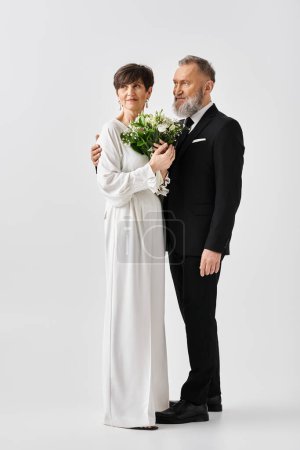 A middle aged bride and groom dressed in white wedding attire, clasping a bouquet of flowers, emanating joy and love.