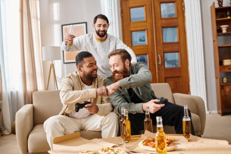 Three handsome, interracial men in casual attire cheerfully sit around a table with beer, sharing laughter and camaraderie.