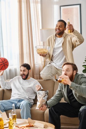 Photo for Three cheerful men of different races sit atop a couch, enjoying slices of pizza in a cozy home setting. - Royalty Free Image