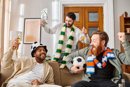 Three handsome men, different ethnicities, dressed casually, share joy atop a couch.