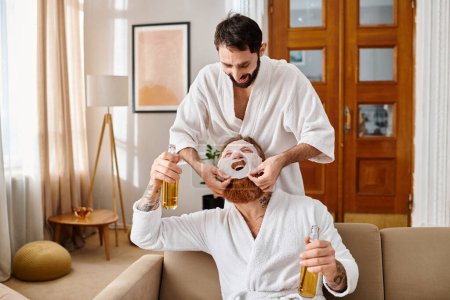 A man in a robe putting face mask on face of his friend in a cheerful setting.