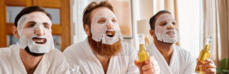 Photo for Three diverse, cheerful men in bathrobes, enjoying beers while wearing facial masks. - Royalty Free Image