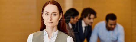 Photo for A woman confidently stands before a group of men, diverse in ethnicity, in a business setting. - Royalty Free Image