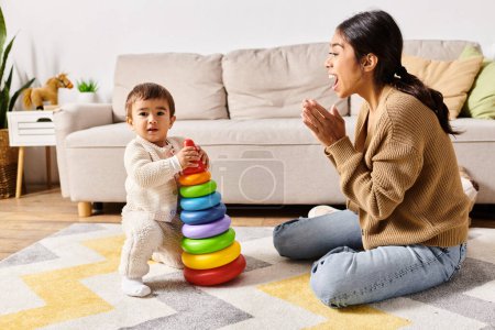 A young Asian mother joyfully engages with her little son on the floor of their cozy living room.