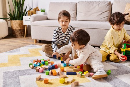 Three children of Asian descent play together on the floor, stacking wooden blocks in a living room at home.