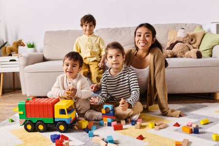 Eine junge asiatische Mutter sitzt mit ihren kleinen Söhnen in einem gemütlichen Wohnzimmer auf dem Boden und teilt einen kostbaren Moment miteinander.