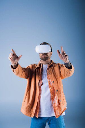 A man wearing a virtual reality headset in a studio setting, exploring the digital world of the Metaverse.
