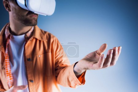 A man in a studio setting wearing a virtual reality glasses, exploring the Metaverse.