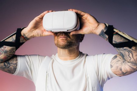 A man in a white shirt holds a white object over his head, immersed in a virtual reality headset in a studio setting.