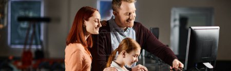 Un homme et une famille regardent joyeusement ensemble un écran d'ordinateur, absorbé par le monde numérique qui se déroule devant eux.