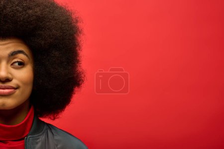 Photo for African american woman in red shirt posing stylishly. - Royalty Free Image