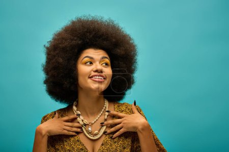 A fashionable African American woman with a voluminous afro poses in trendy attire against a vibrant backdrop.