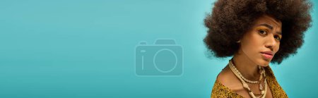 Photo for Stylish African American woman with curly hairdoposes on a vibrant backdrop. - Royalty Free Image