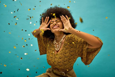 Photo for Woman in trendy attire with hands on face, surrounded by falling confetti. - Royalty Free Image