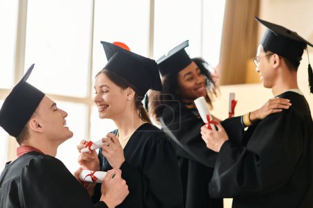 A multicultural group of students in graduation gowns and caps celebrating their academic achievements with smiles.