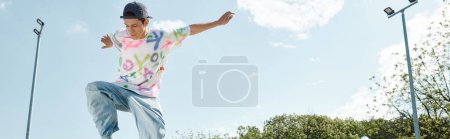 Photo for A young skater boy maneuvers his skateboard down a ramp in a vibrant skate park on a sunny summer day. - Royalty Free Image