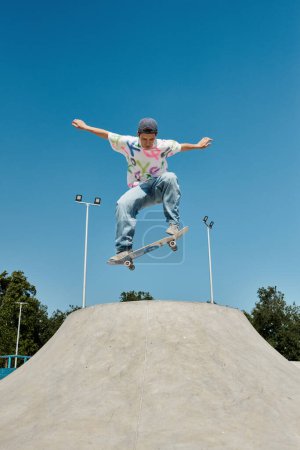 A young skater boy defies gravity, soaring through the air on his skateboard at a sunlit skate park.