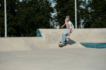 Photo for A young skater boy fearlessly rides his skateboard up the side of a ramp in a bustling outdoor skate park on a sunny summer day. - Royalty Free Image
