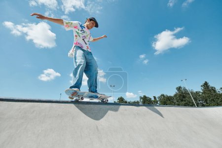 A young skater boy fearlessly rides his skateboard down the steep ramp at the outdoor skate park on a sunny summer day.