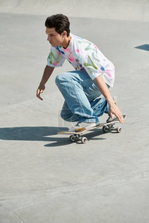A young man confidently riding a skateboard down a cement ramp in a skate park on a sunny summer day.