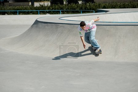 A young skater boy confidently rides his skateboard up a steep ramp in a sunny outdoor skate park.