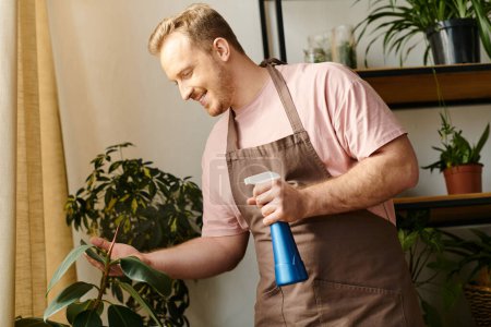 A man in an apron holding a spray bottle, tending to plants in a small business plant shop.