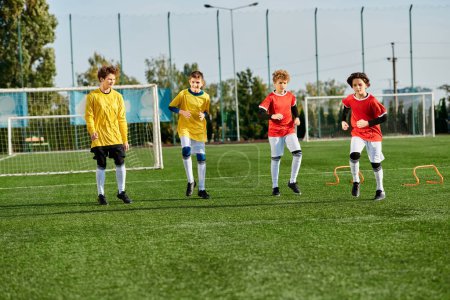 A lively group of young boys play a game of soccer, kicking the ball back and forth with enthusiasm on a grassy field. They are dressed in colorful jerseys and are focused on scoring goals while displaying teamwork and skill.