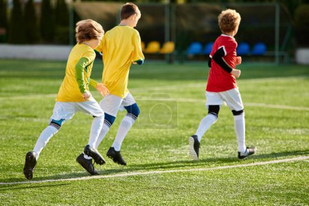 Photo for A dynamic scene unfolds as a group of young men engage in a spirited game of soccer, showcasing their agility, teamwork, and competitive spirit on the field. - Royalty Free Image