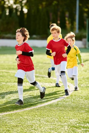 A diverse group of energetic children run gleefully on a vibrant green soccer field, their expressions filled with excitement and determination as they chase after a soccer ball.