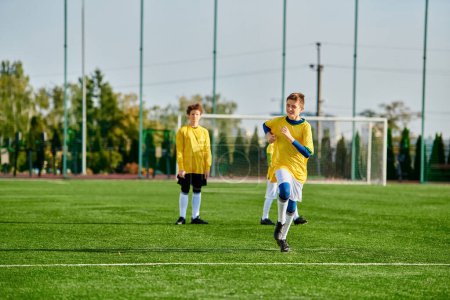 Photo for A vibrant scene unfolds as a group of young men engrossed in an intense game of soccer. Their quick passes, dribbles, and shots create an atmosphere of passion and energy on the field. - Royalty Free Image