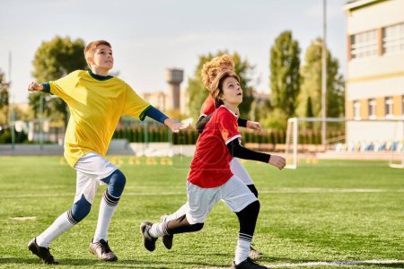 Photo for A spirited group of young men engage in an intense game of soccer, showcasing their skill, agility, and teamwork on the field as they chase the ball and strive to outmaneuver their opponents. - Royalty Free Image