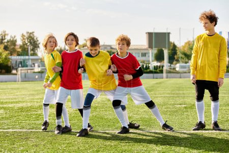A vibrant group of youthful individuals stands proudly on the top of a soccer field, exuding energy and enthusiasm. They are united in their love for the game, their camaraderie evident in their smiles and poses.