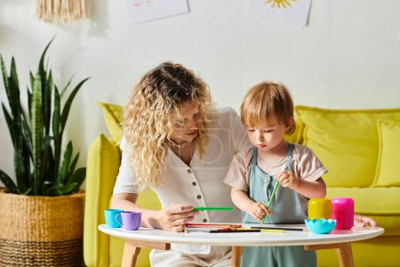 A curly-haired mother and her toddler daughter happily engage in Montessori-style play with toys at home.